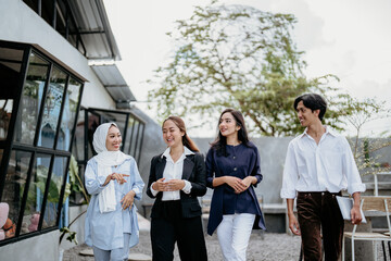 Asian businessmen walk when meeting and gathering at outdoor coffee shops