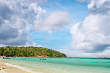 Vacation in paradise. Travel by Thailand. Beautiful landscape with white sand tropical beach and turquoise water.