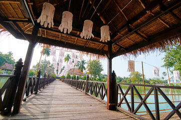 Lanterns hang to decorate the bridge in front of the temple in Sukhothai Old City Park