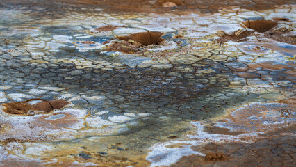 Hverir geothermal area in northern iceland in summer, close up of the ground with its cracks and colors