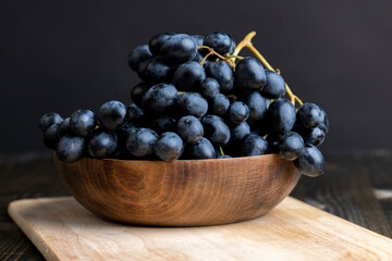 Unwashed blue grapes in the dust