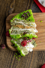 A piece of sweet green cake with berries