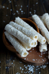 Waffle tubes with butter cream and coconut sprinkles