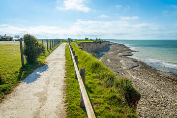 Fototapeta na wymiar Pedestrian path on the coast of the Ré island in La Flotte, France