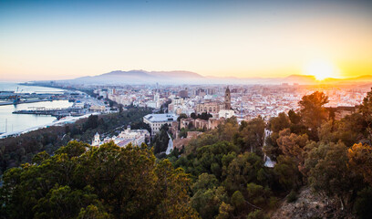 view over Malaga at sunset travel banner