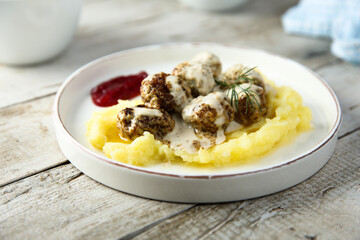 Traditional Swedish meatballs with potato and sauce