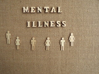 mental illness wooden letters and figurines of men and women
