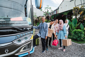 happy asian muslim passengers going on bus road trip for eid mubarak holiday