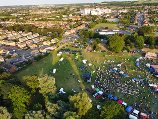 High Angle Footage of Public Funfair Held at Lewsey Public Park of Luton with Free Access for Muslim Community on Islamic Holy Eid Festival Day. Captured with Drone's Camera on June 29th, 2023