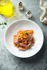 Pasta with tomato sauce and ham