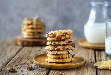 Florence cookies or fiorentine biscuits with almonds on wooden table with milk