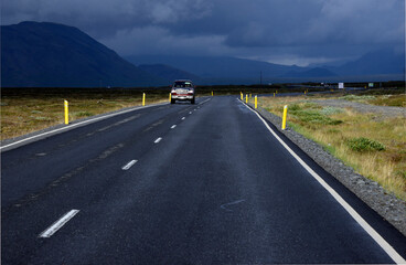 Iceland - one of lowest population density in the world, almost empty road number 360 from Nesjavellir to Thingvellir  surrounded by moss growing on lava, central Iceland, Europe
