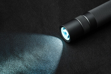 Modern aluminum LED Pocket Flashlight isolated on white background.