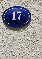 Close up of an house door number 17