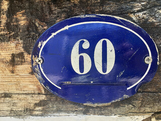 Close up of an house door number 60