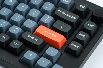 Modern mechanical keyboard for your computer. Gray keyboard with orange accent keys