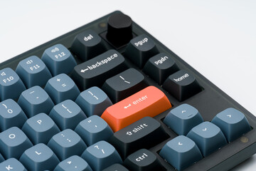 Modern mechanical keyboard for your computer. Gray keyboard with orange accent keys