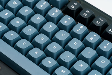 Modern mechanical keyboard for your computer. Gray keyboard with orange accent keys