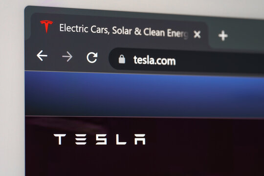 Dnipro, Ukraine 05.07.2023: Photo of Tesla Motors homepage on a monitor screen through. Homepage of Tesla website on the display of PC. URL - Tesla.com