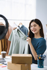 Asia vlogger woman influencer, SME retail store owner smile enjoy selling show live sale online...