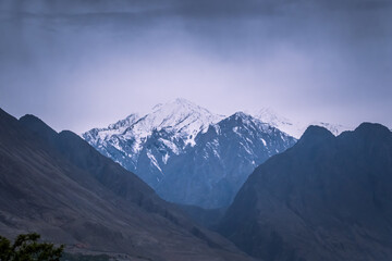 Fototapeta na wymiar Diran mountain peak in Karakoram mountains range in Hunza valley, Gilgit Baltistan in Pakistan.