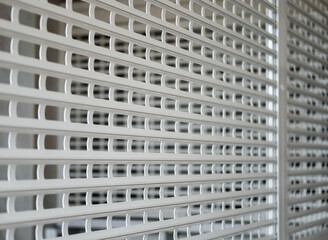 Barred with a white profile grate part of the room
