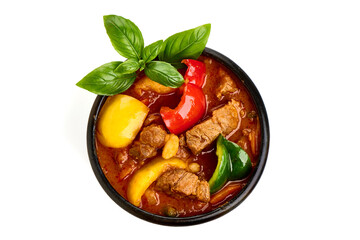 Hungarian goulash, pork stew, isolated on white background.