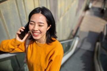 happy young woman talking with cellphone