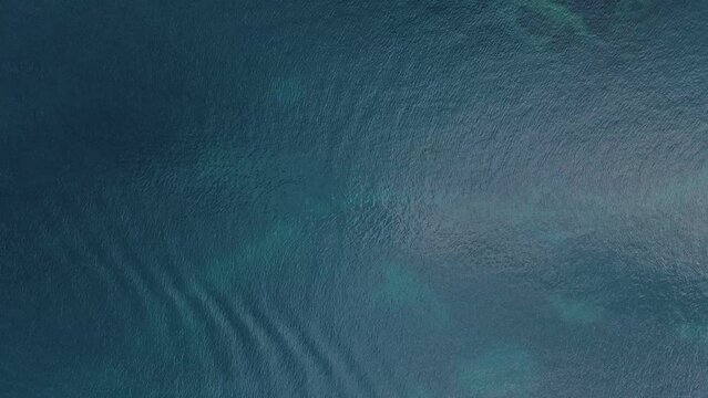 Aerial top down view of rocks in the Mediterranean Sea in Catalonia