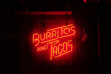 urban dramatic illuminated night neon light red sign advertising shop food business