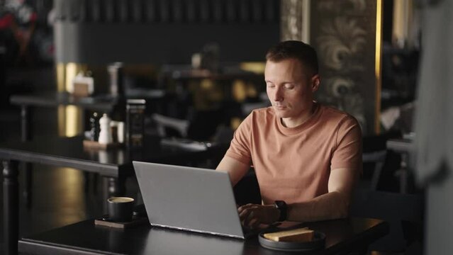 Freelancer Working With Laptop In Cafe, Smart Man Is Programmer Or Web Developer