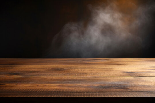 Smoke on a wooden table in front of a black background. High quality photo