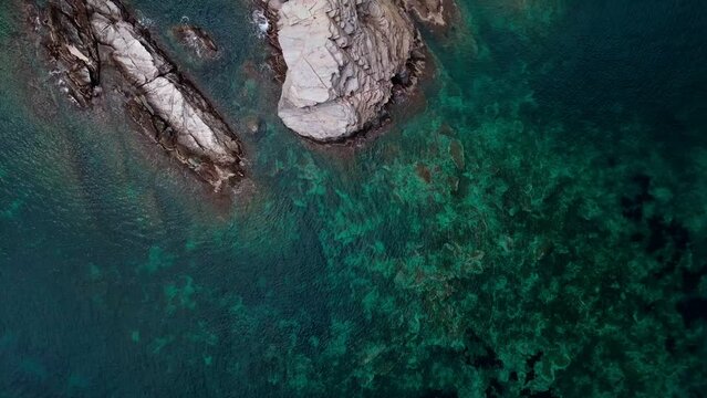 Aerial top down view of rocks in the Mediterranean Sea along Costa Brava Catalonia