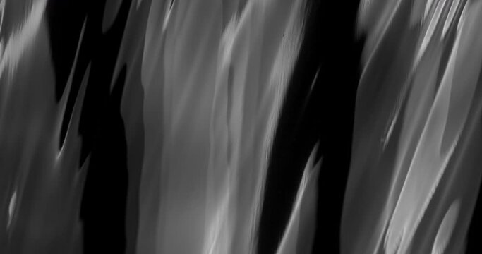 Uncover the fascinating allure of a background texture inspired by the crumpled and creased surface of black plastic, providing a captivating visual foundation for artistic and design projects.