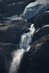 a sign of climate change. waterfall of meltwater at Triftgletscher, Berner Oberland