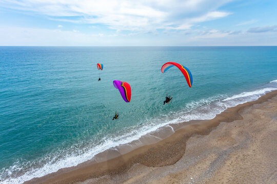 Aerial view of three paramotors, Mediterranean Sea coast, Side, Antalya, Turkey.