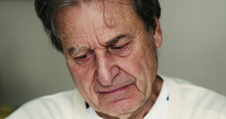 Older man suffering from depression portrait face closeup