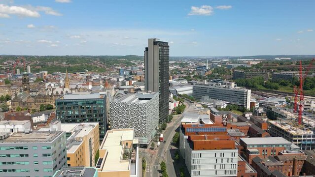 Aerial drone video of the city centre in Sheffield England with many office buildings