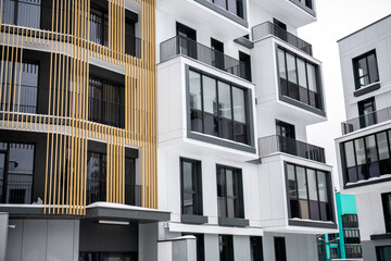 Just new builded luxury apartament house, windows and balcony in winter