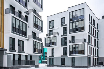 Fototapeta premium Colorful Modern residential apartment and flat building exterior. New luxury house and home complex. City Real estate property and condo architecture