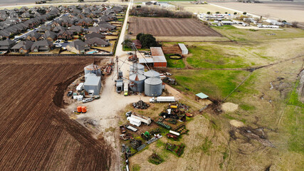 Above the Fields: Aerial View of Quaint Farm and Rustic Silo