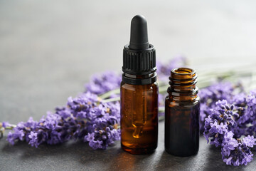 Obraz na płótnie Canvas Bottles of lavender essential oil with copy space