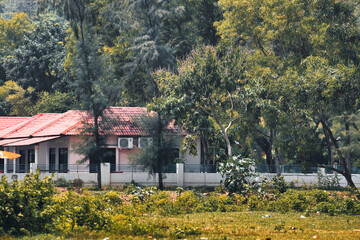 a house in a rural area with trees surround it