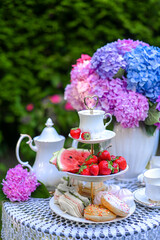 traditional English tea, high tea. 
picnic in the garden.