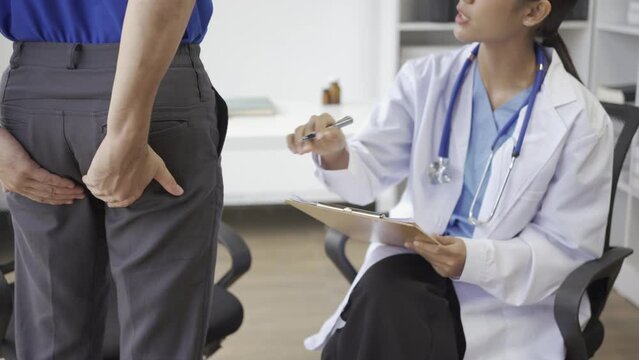 young man consulting doctor Doctor holding rectal suppository before entering hemorrhoids or treatment concept