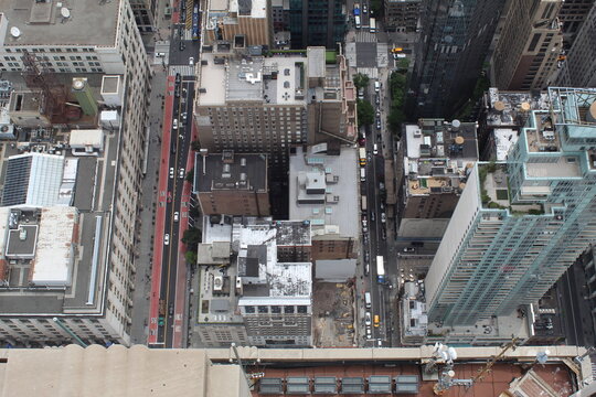 A photo of large buildings and its surroundings in New York City. 