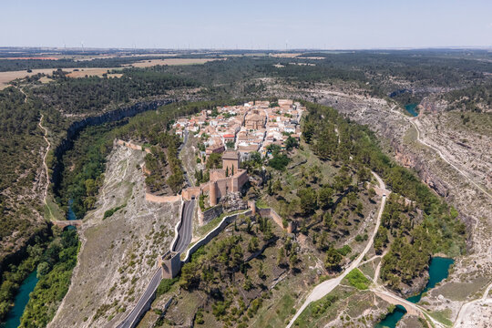 Aerial view of Alarcon, a medieval town with castle on top along the Rio Jucar river in Cuenca, Spain.