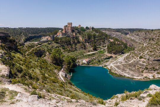 Aerial view of Alarcon, a medieval town with castle on top along the Rio Jucar river in Cuenca, Spain.