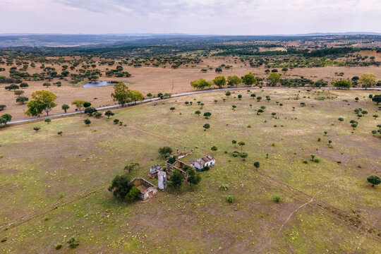 Aerial view of abandoned houses in the countryside along the Spanish and Portuguese border, Zebreira, Castel Branco, Portugal.