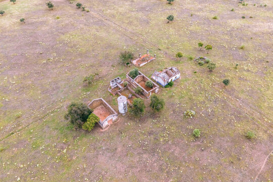 Aerial view of abandoned houses in the countryside along the Spanish and Portuguese border, Zebreira, Castel Branco, Portugal.